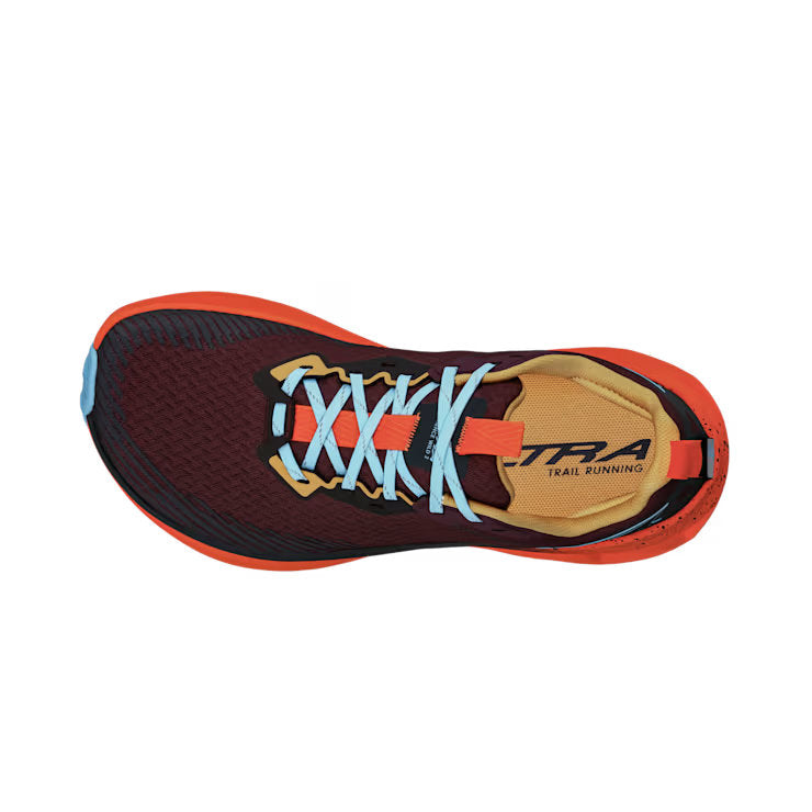 Top view of a red trail running shoe with orange accents and blue laces against a white background.