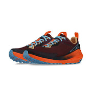 Side view of a pair of red shoes with orange accents and blue laces against a white background. 
