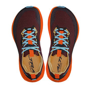 Top view of a pair of red shoes with orange accents and blue laces against a white background. 