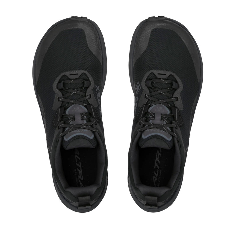 A pair of black running shoes on a white background