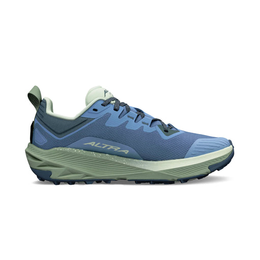 A blue running shoe with a green bottom on a white background
