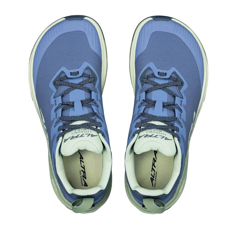 A pair of blue running shoes from above on a white background