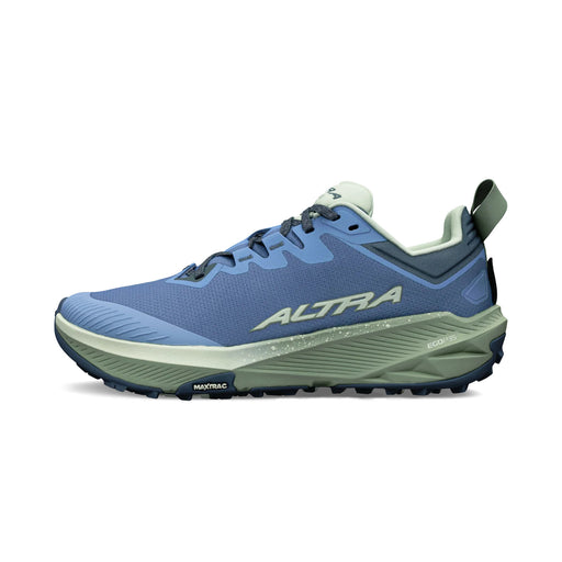 A blue running shoe with a green bottom on a white background