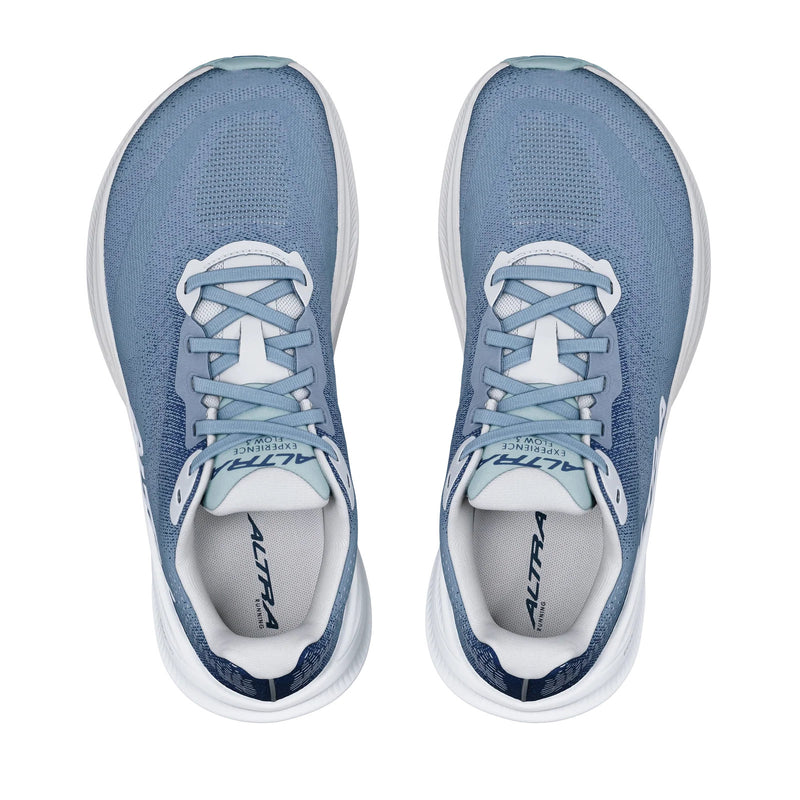A pair of blue running shoes from a birds eye view