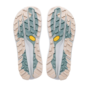 The soles of a pair of trail running shoes, showing a beige and white tread pattern with sage green accents and yellow Vibram logos.