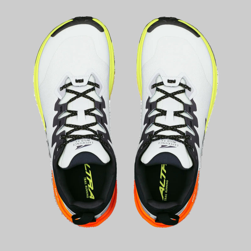 A pair of white running shoes from above on a white background