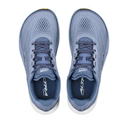 A pair of light blue running shoes from above on a white background