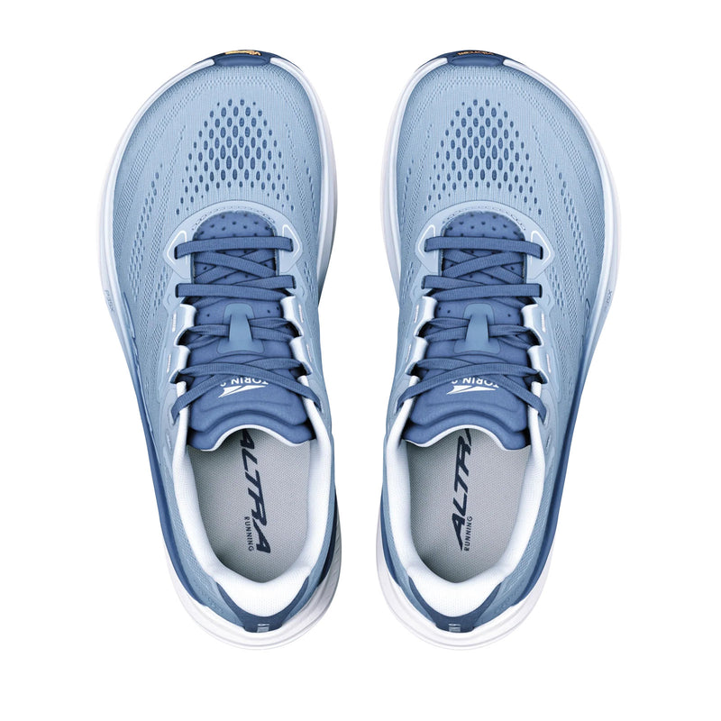 A pair of light blue running shoes from above on a white background
