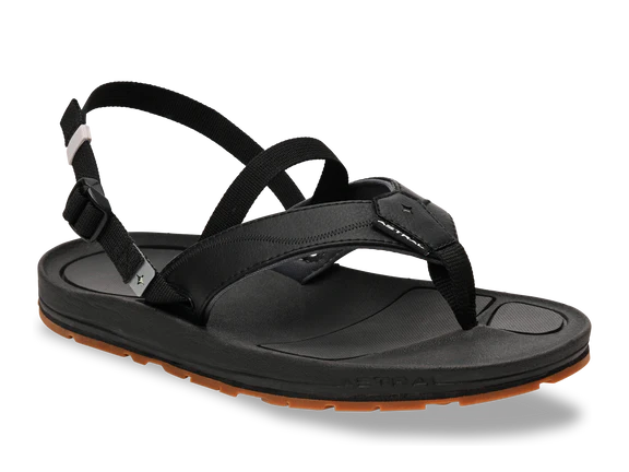 Side view of a black sandal with a brown tread against a white background. 