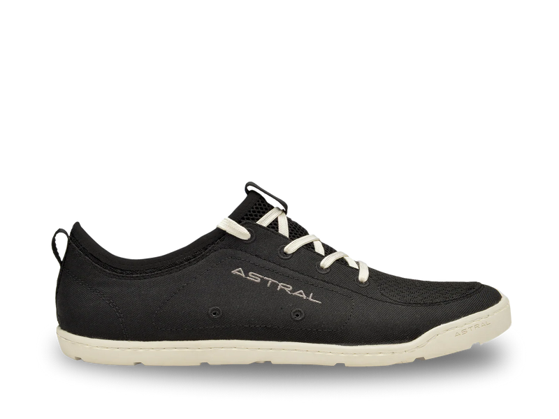 Black shoe with white laces and sole on a white background, featuring the brand 'Astral'.