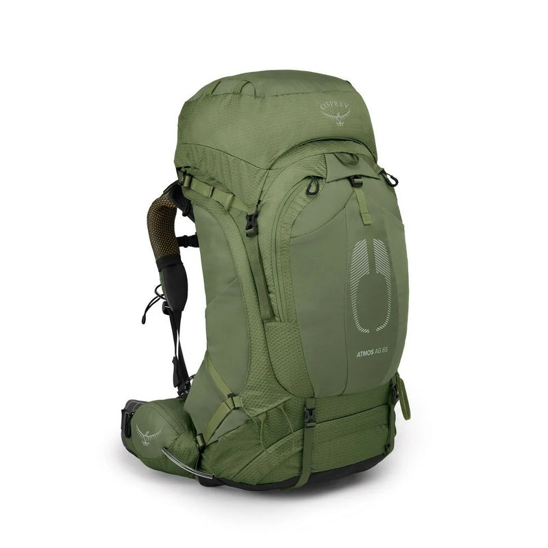The back of a green hiking backpack on a white background