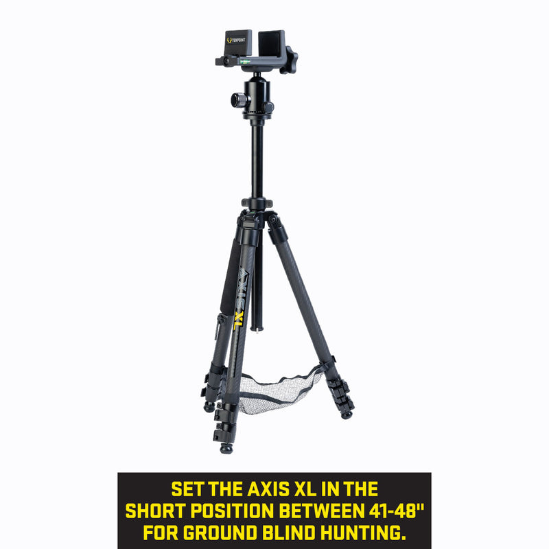 A black Axis XL tripod with a mounted mesh shelf shown on a white background with a black text banner at the bottom that reads: 'SET THE AXIS XL IN THE SHORT POSITION BETWEEN 41-48" FOR GROUND BLIND HUNTING.'.