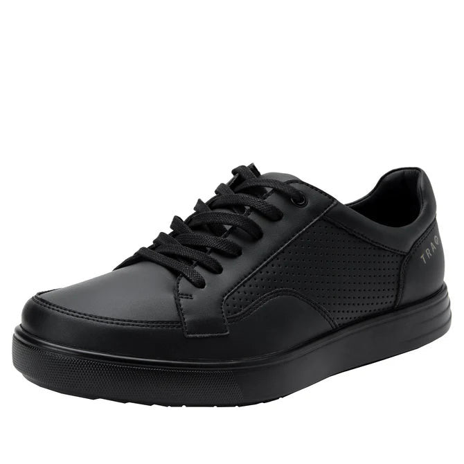 Side view of a completely black shoe against a white background. 