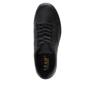 Top-down view of a completely black shoe against a white background.