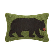 Green rectangular pillow featuring a black bear design against a white background. 