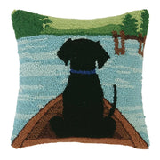 Square throw pillow featuring a design of a dog at the head of a canoe against a white background. 