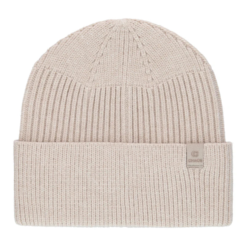 White knit beanie against a white background.