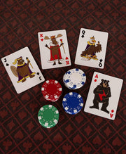 Deck of cards as well as game chips with cartoonish wildlife on them.