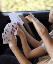 Deck of cards for the game I Spy with cartoon style wildlife and nature prints on them. 