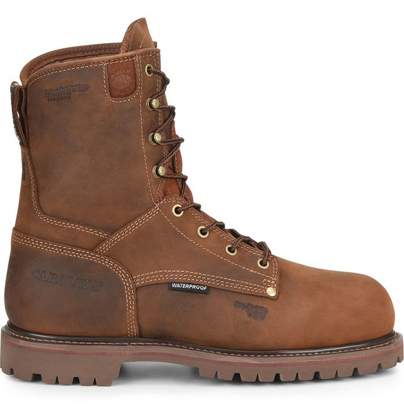 A brown leather work boot with brass eyelets and lace hooks, stamped with the Carolina boots branding, and a "waterproof" tag stitched into a seam, shown from the side on a white background