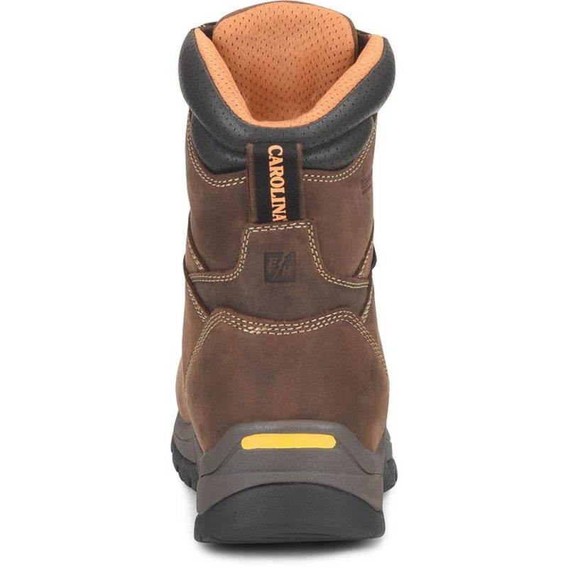 The rear view of a brown Carolina work boot with black, grey, and yellow sole, black collar, and orange mesh collar interior.