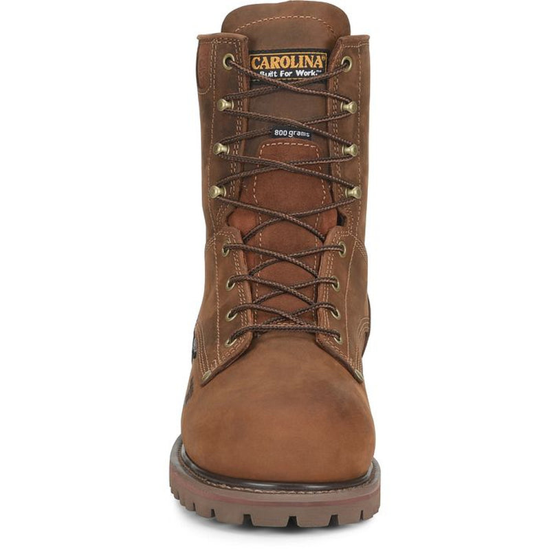 A brown leather work boot with dark brown laces, brass eyelets, and a rugged sole, shown from a front-facing perspective on a white background. The tongue features the Carolina brand logo.