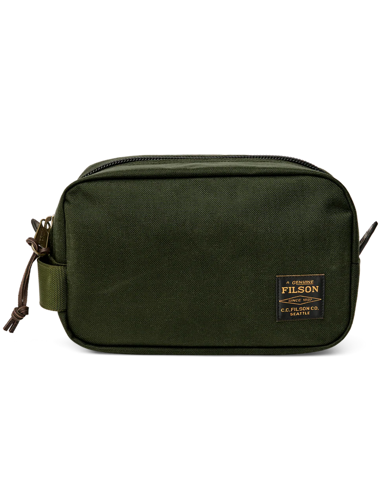 Dark green travel bag with Filson logo against a white background. 