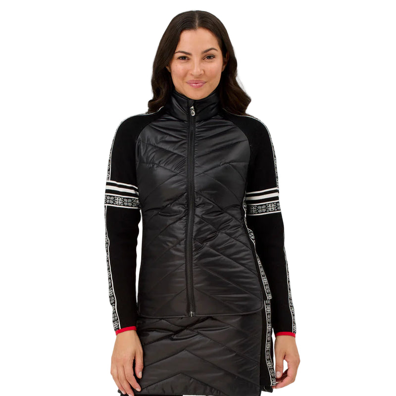 Woman wearing a black puffer jacket with white accents on a light gray background