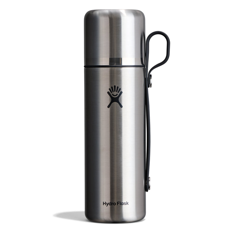 A Hydro Flask stainless steel water bottle with a black carrying loop, shown on a clean white background.