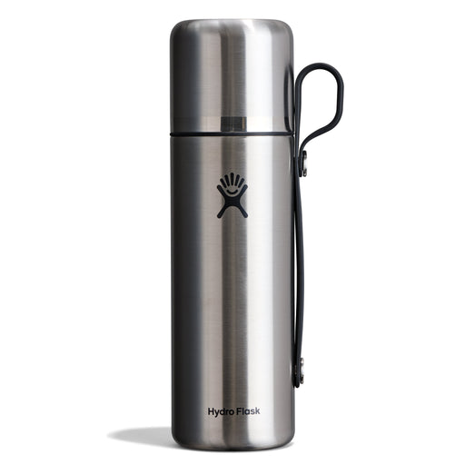 A Hydro Flask stainless steel water bottle with a black carrying loop, shown on a clean white background.