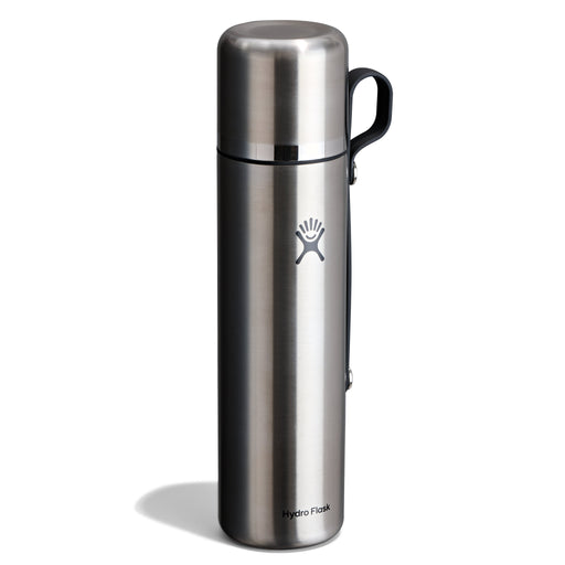 A Hydro Flask stainless steel vacuum flask with a black handle, shown on a white background with a soft shadow.