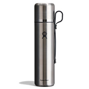 A Hydro Flask stainless steel water bottle with a black carrying loop, shown on a clean white background.