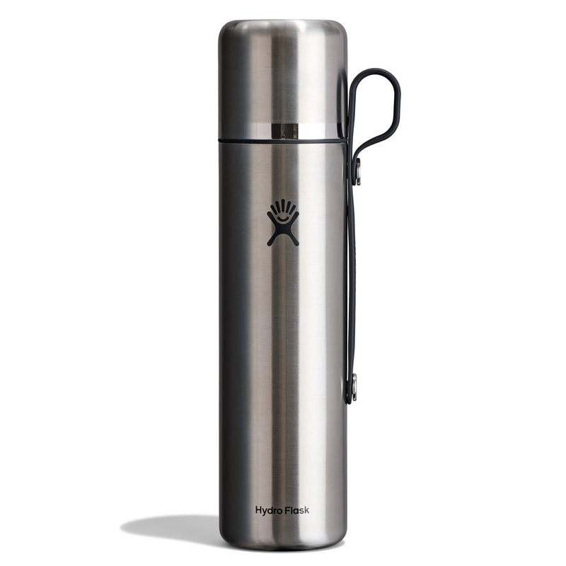 A Hydro Flask stainless steel water bottle with a black carrying loop, shown on a clean white background.