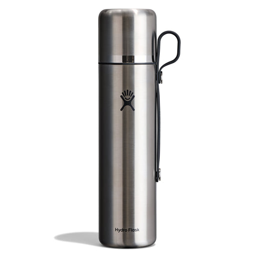 A Hydro Flask stainless steel water bottle with a black carrying loop, shown on a clean white background.