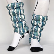 Front and side view of a model wearing white and blue gaiters against a white background. 