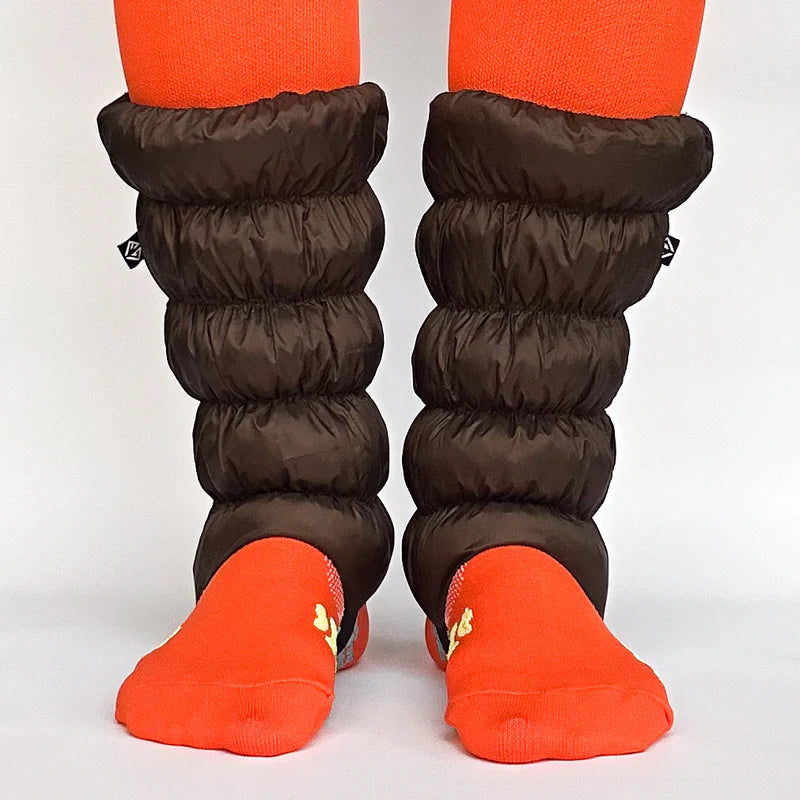 Front facing view of brown, waterproof gaiters against a white background.