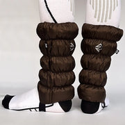 Back view of brown, waterproof gaiters against a white background.