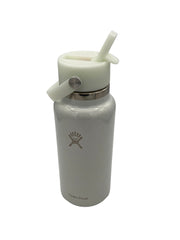 Pale blue iridescent shimmer water bottle with straw lid on a white background