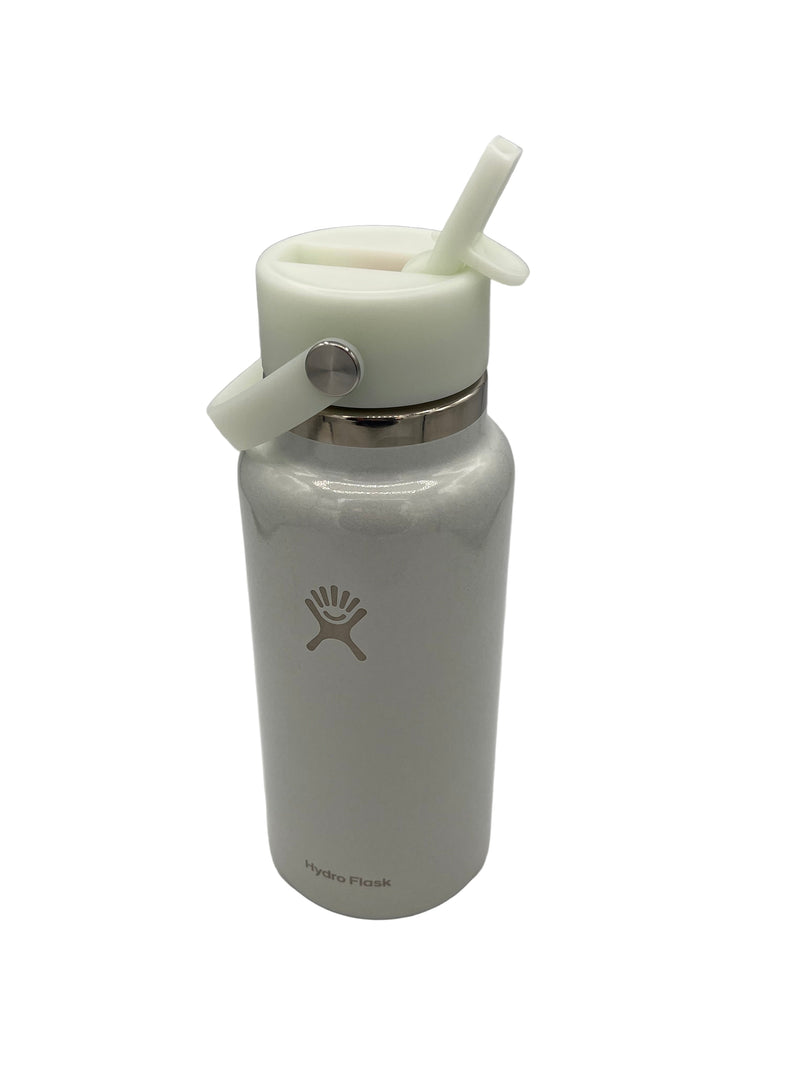 Pale blue iridescent shimmer water bottle with straw lid on a white background