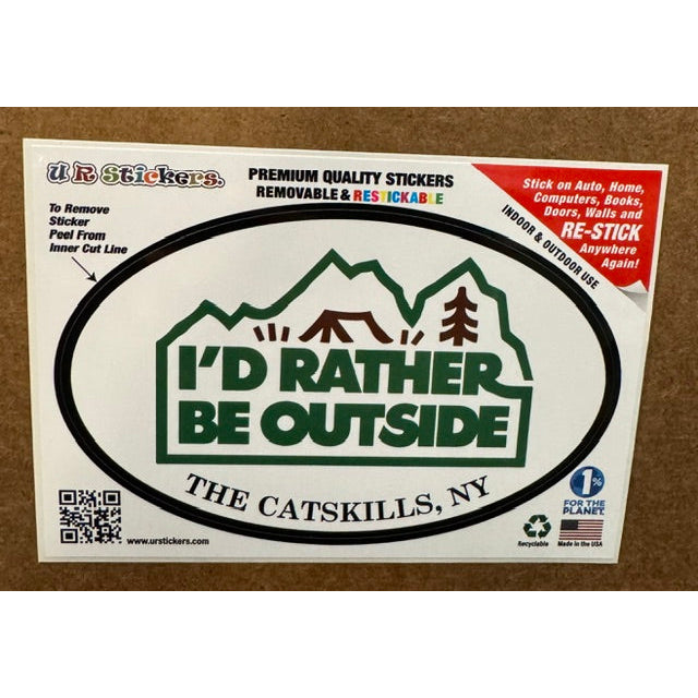 A white and green sticker with the text "i'd rather be outside" on a wooden background.