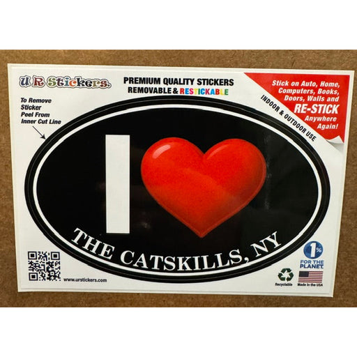 A black and red sticker with the text "i heart the catskills" on a wooden background.