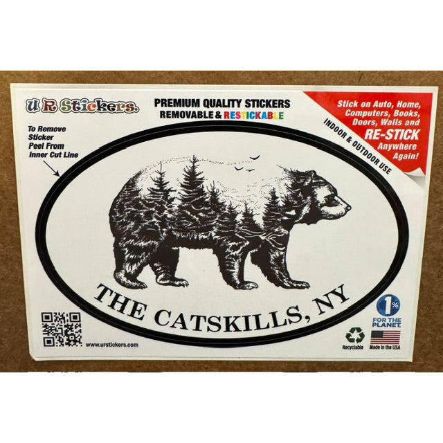 Sticker with a bear and the text "The Catskills, NY" on a wooden background.