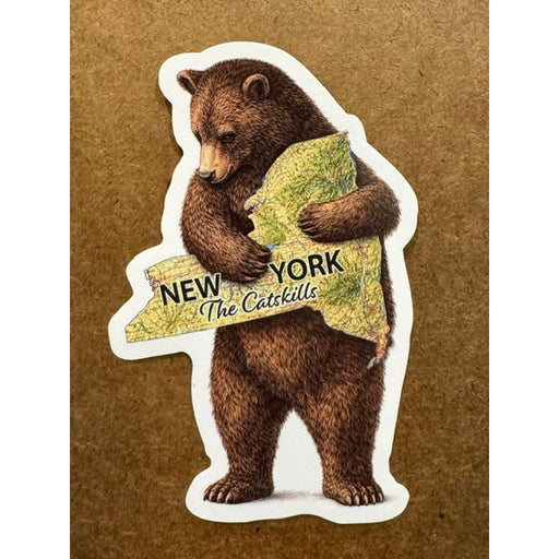 Sticker of a bear holding a New York shaped map on a wooden background.