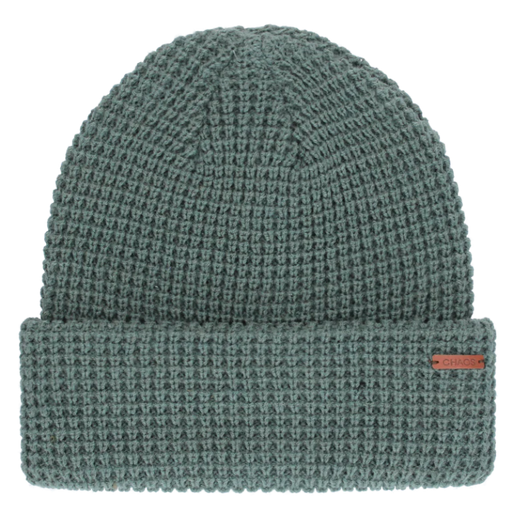 Teal knit beanie against a white background. 