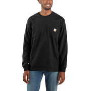 Smiling man wearing a long sleeve black shirt with a chest pocket against a white background. The chest pocket has a Carhartt logo on it.