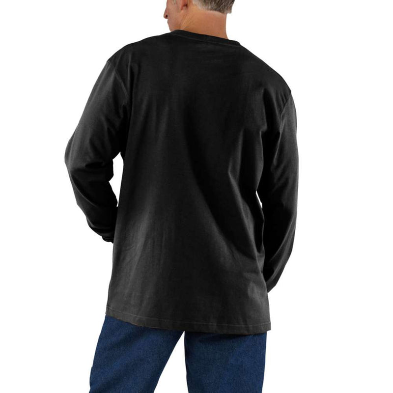 Back view of a man wearing a black long sleeve shirt against a white background. 