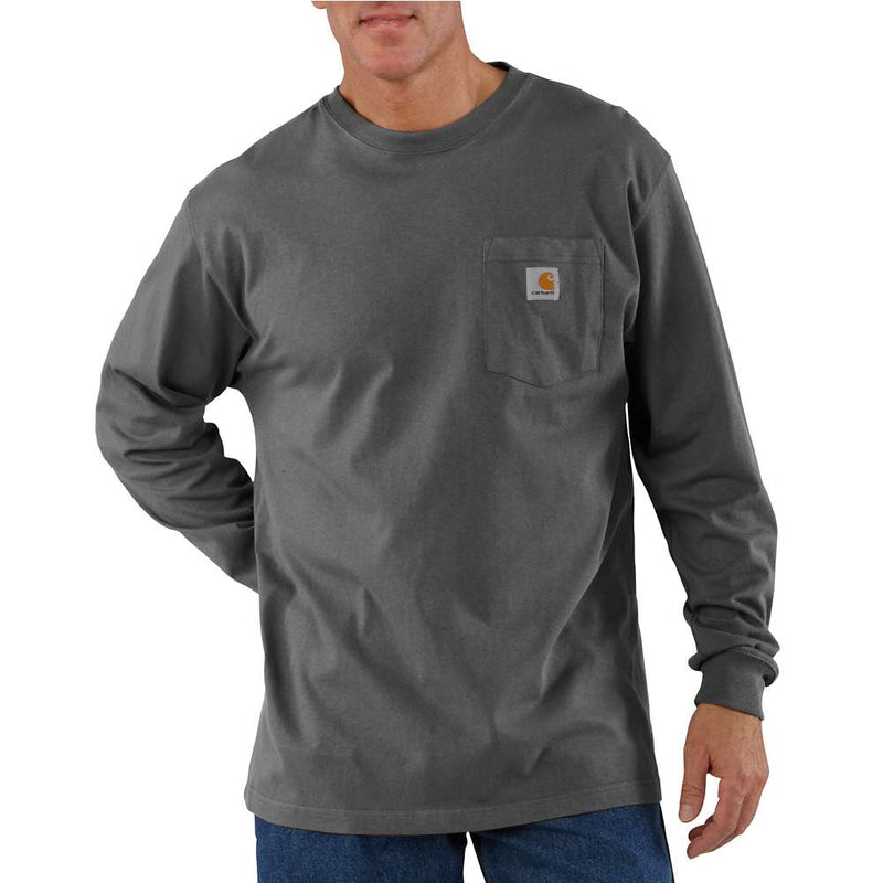 Man wearing a long sleeve carbon gray heather colored shirt against a white background. the shirt has a chest pocket with a Carhartt logo on it. 