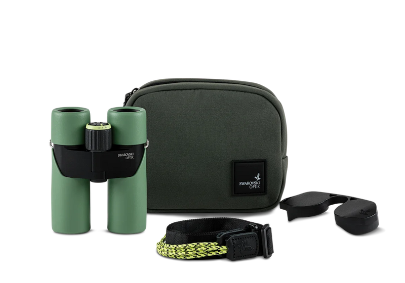 Green binoculars alongside a carrying case and various other accessories on a white background.