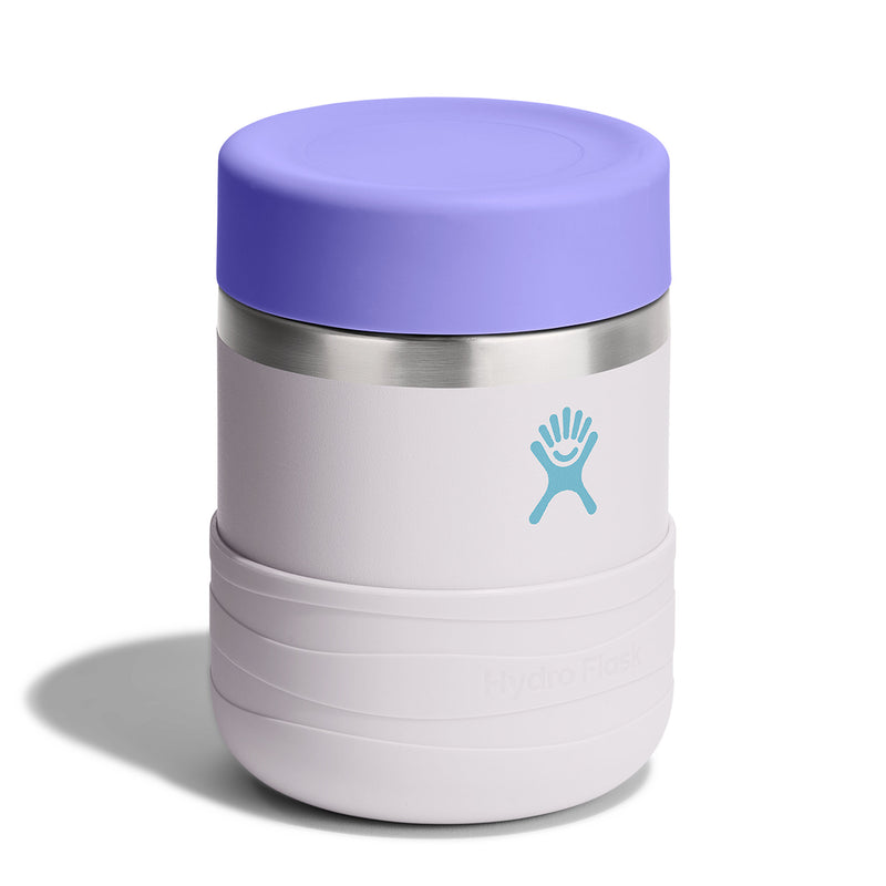 A Hydro Flask vacuum-insulated travel tumbler with a lavender purple lid, a light gray body, a silver stainless steel band, and a light blue Hydro Flask logo on the front, set against a plain white background.
