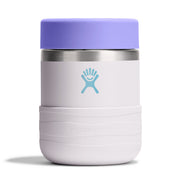 A Hydro Flask insulated tumbler with a lavender purple lid, a light lavender body, a blue Hydro Flask logo, and a silver stainless steel band near the top, shown on a white background.